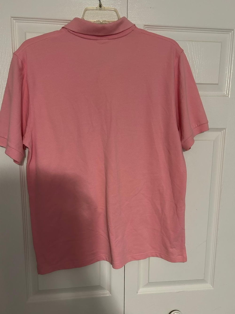 pink, short-sleeve polo shirt that may be associated with Justin Bieber's tour View 3
